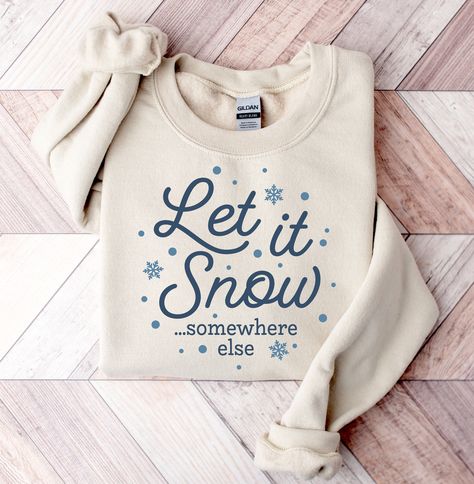 Let it Snow Somewhere Else Sweatshirt Cold Weather Sweater Funny Winter Shirt Always Cold Crewneck Winter Christmas Shirt Funny Snow Pullover * Shipping on Faster End for U.S.* -Unisex crewneck sweatshirt -For oversized look size up 1-2 sizes -Comfy & Cozy -Ink designs -Collar is ribbed knit, so it retains its shape even after washing. -No itchy side seams -50% cotton, 50% polyester -Medium-heavy fabric -Loose fit -Sewn-in label -Runs true to size -Machine Wash Cold Sweater Weather Sweatshirt, Sweater Vinyl Ideas, Winter Graphic Tees, Winter Shirt Designs, Sweater Sayings, Christmas Sweatshirt Ideas, I Hate Winter, Let It Snow Somewhere Else, Cold Sweatshirt