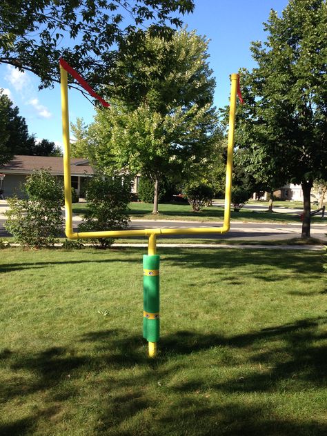 Semi-permanent field telescopic goal post from pvc pipe, giant pool noodle, crepe paper, duct tape, metal post Pool Noodle Football Goal Post, Diy Wiffle Ball Field, Chiefs Bedroom, Diy Field Goal Post, Pvc Field Goal Post, Diy Football Goal Post, Pvc Goal Post Football, Pool Noodle Croquet, Flag Football Party