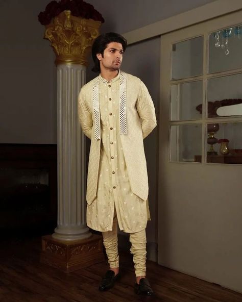 The Yajy Yuga Bandi Set features a beautiful play of abla mirrorwork and glinting motifs. Luxurious yet leisurely, this sage green bandi with notched lapel is curated from handwoven fabric – lending a rich, detailed sartorial look. #yajy #yajybyaj #yajybyadityajain #newdrop #rameo #groomwear #groomweardesigners #groomwear #groomwearfashion #groomwearideas #groomwearoutfit #mensoutfit #mensstyle #menswear #weddingwear #weddingideas #madetoorder Traditional Indian Mens Clothing, Indian Wedding Suits Men, Indian Wedding Clothes For Men, Cloth Collection, Waistcoat Designs, Best Man's Outfit, Mens Indian Wear, Wedding Kurta For Men, Formal Dresses For Men