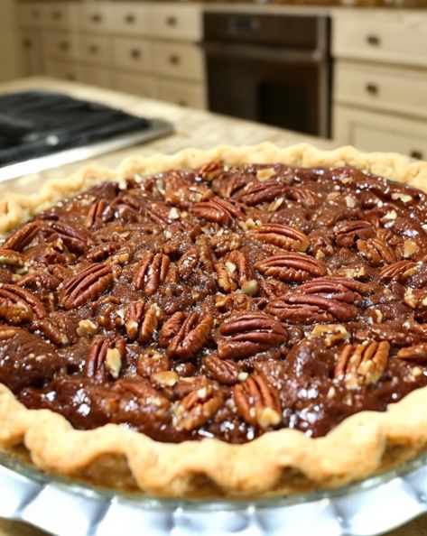 Decadent Chocolate Pecan Pie infused with smooth Bourbon flavor—perfect for festive gatherings! Indulge in this irresistibly rich dessert. #ChocolatePie #PecanPie #BourbonDessert #HolidayBaking #FestiveTreats Bourbon Chocolate Chip Pecan Pie, Chocolate Pecan Bourbon Pie, Pecan Pie With Bourbon, Bourbon Dessert, Bourbon Pecan Pie Recipe, Chocolate Chip Pecan Pie, Chocolate Bourbon Pecan Pie, Caramel Pecan Pie, Bourbon Chocolate