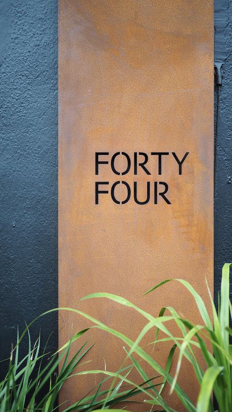 corten steel unit number plate with black painted facade Corten Steel Front Door, Copper Signage, Corten Steel Signage, Corten Steel Facade, Steel Signage, House Gates, Super Safari, Shop Front Signs, Roadside Signs