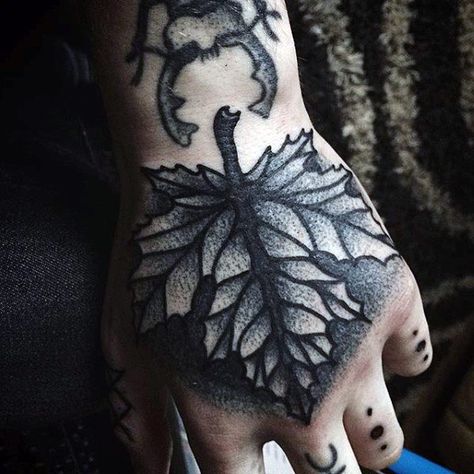 Man With Shaded Autumn Leaf Hand Tattoo In Black Ink Masculine Leaf Tattoo, Hand Tattoos For Black Women, Leaf Hand Tattoo, Cute Hand Tattoo, Nature Tattoos For Men, Tattoos For Hand, Best Hand Tattoos, Nature Tattoo Ideas, Simple Hand Tattoos