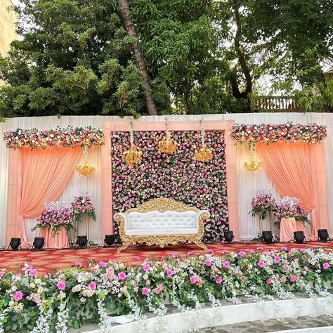 "Step into a world of enchantment at our reception stage, where the soothing tones of peach envelop you in warmth and grace. Lush floral arrangements in shades of peach, cream, and blush create a dreamy atmosphere, perfect for celebrating love and new beginnings. #PeachPerfection #FloralElegance #WeddingDecorInspo" Simple Reception, Indoor Wedding Decorations, Green Wedding Decorations, Reception Stage, Dreamy Atmosphere, Flower Garland Wedding, Wedding Stage Decor, Stage Decor, Marriage Decoration