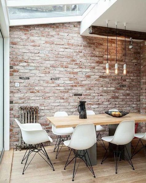 Now that this exposed brick wall is all yours, how do you blend it with the rest of your decor? Since buying all new stuff isn't really part of the budget, read on for 10 killer ways to rock that beautiful brickwork in your humble abode. #hunkerhome #brickwall #exposedbrick #brickwallideas #brickideas Brick Wall Dining Room, Brick Wall Ideas, Interior Brick, Brick Interior Wall, Dining Room Industrial, Brick Interior, Dining Room Contemporary, Dining Room Ideas, Exposed Brick Walls