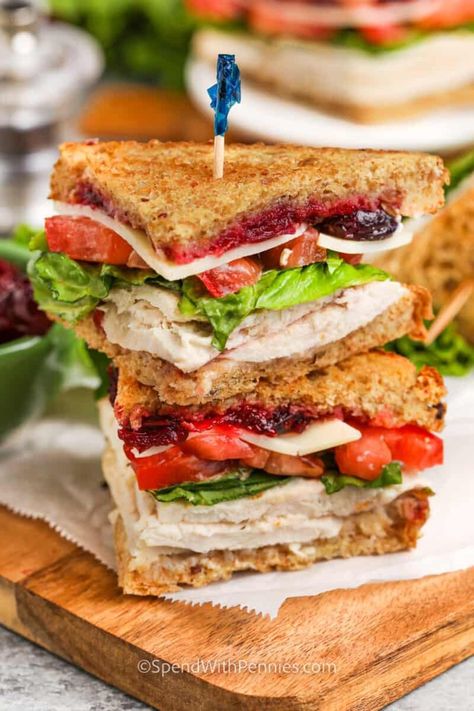 This turkey sandwich recipe is a staple that every kitchen should have on hand. Load up leftover turkey with cranberry sauce on your favorite bread and top it with cheese, bacon, avocado, and other favorite turkey sandwich fixings! Serve it hot or cold for lunch or a midnight snack after the festivities are over! #turkeysandwich #turkeysandwichrecipe #leftoverturkey #spendwithpennies Deli Turkey Recipes Dinner, Whimsical Bakery, Sandwich Fixings, Blt Grilled Cheese, Hot Turkey Sandwiches, Turkey Salad Recipe, Grilled Cheese With Tomato, Turkey Breast Crockpot, Turkey Sandwiches Recipes