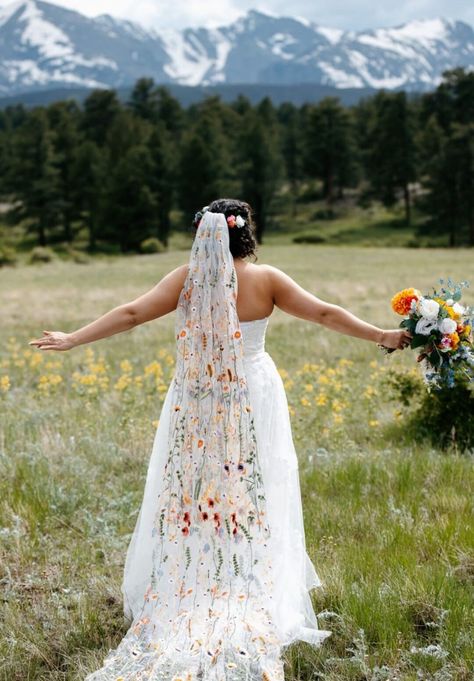 This is a duplicate listing of my wildflower veils with just the Orange Wildflower tulle, as it has become so popular.  *Mountain wedding photos showcase a 240cm wildflower veil in orange. Photos taken by the talented www.sweetjusticephoto.com (Colorado US). *70's styled photoshoot (further details below) photography by the wonderful  www.tonypullenphotography.co.uk (Rochester UK) This stunning floral veil is perfect for any wedding or celebration. Scattered with embroidered wildflowers and leav Embroidered Wildflower Veil, Boho Wildflower Wedding Dress, Wedding Dress With Embroidered Veil, Wild Flower Veil Wedding, Wildflower Wedding Dresses, Wedding Floral Veil, Flower Embroidered Wedding Veil, Embroidered Bridal Veil, Bridal Veil With Flowers