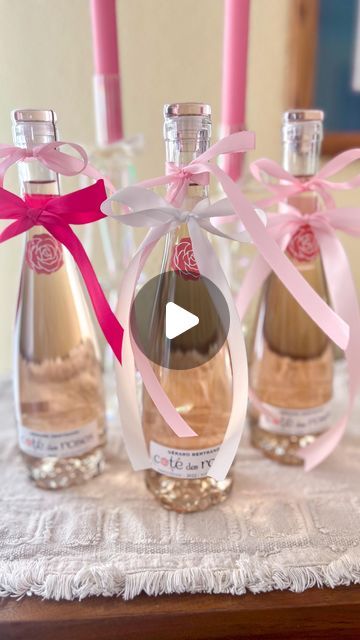 Andrea Clawson on Instagram: "This bow trend is the BEST one yet, am I right? 🎀 🍷 Perfect Galentine’s day party favors- tie two satin ribbons into a bow on these adorable mini @thecotedesroses Such an easy and super cuuute way to gift a bottle of your favorite wine or add to your Valentine’s day decor. Save + share with your pink loving friends 🥰😍 #diypartyideas #diypartydecor #bowtrend #pinkaesthetic #coquette #coquetteaesthetic #pinkparty #diybows #galentinesday #galentines #galentinesparty #valentinedrinks #cocktails #craftymom #craftymama" Mini Wine Bottle Favors, Valentine Drinks, Christmas Bridal Showers, Mini Champagne Bottles, Mini Wine Bottles, Bridal Shower Inspo, Galentines Party, How To Tie Ribbon, Chic Holiday