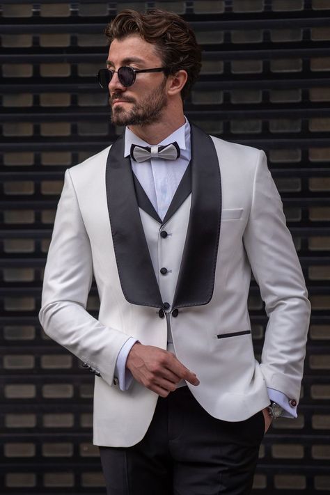 Define your iconic style with the White Slim-Fit Tuxedo 3-Piece Suit by VIOSSI. The single-button blazer boasting luxurious shawl lapels, coupled with the coordinated waistcoat and trousers, sets a standard of sophistication, grace, and distinction for the modern gentleman. #suit #suits #formalwear #t #whitesuit #slimfit #tuxedo #shawllapels #mensfashion #iconiclook #refinedelegance White Tuxedo For Men, Tuxedo Dress Prom, White Tuxedo Dress, Men Tailored Suit, White Dinner Jacket, White Tuxedo Wedding, Tuxedo Suit For Men, Tuxedo White, Tuxedo Wedding Suit