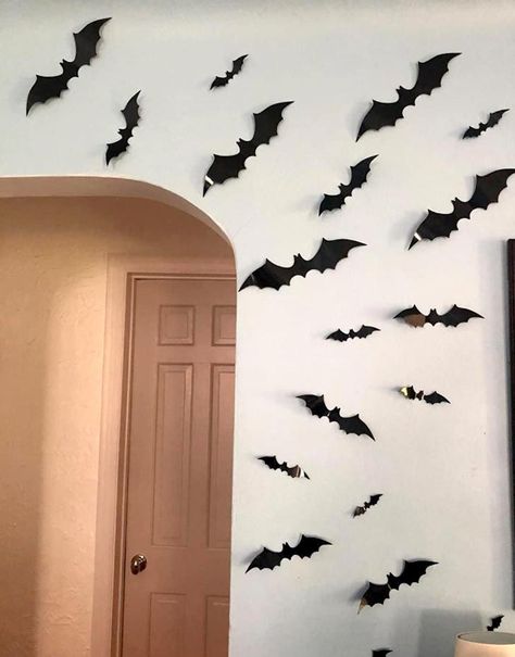 If we're trying to achieve maximum spook in a small apartment, then wall decals will do the trick. And honestly, placing these vinyl bats on the wall is one of the best Halloween decorating ideas.A cauldron of bats (yes, a group of bats is sometimes called a cauldron) looks spooky by day, terrifying by night, and sets up a perfect Halloween party atmosphere. Bats On The Wall, Halloween Apartment, Halloween Decorations Apartment, Scary Bat, Halloween Eve, Halloween Vinyl, Halloween Door Mat, Alternative Christmas, Halloween Lanterns