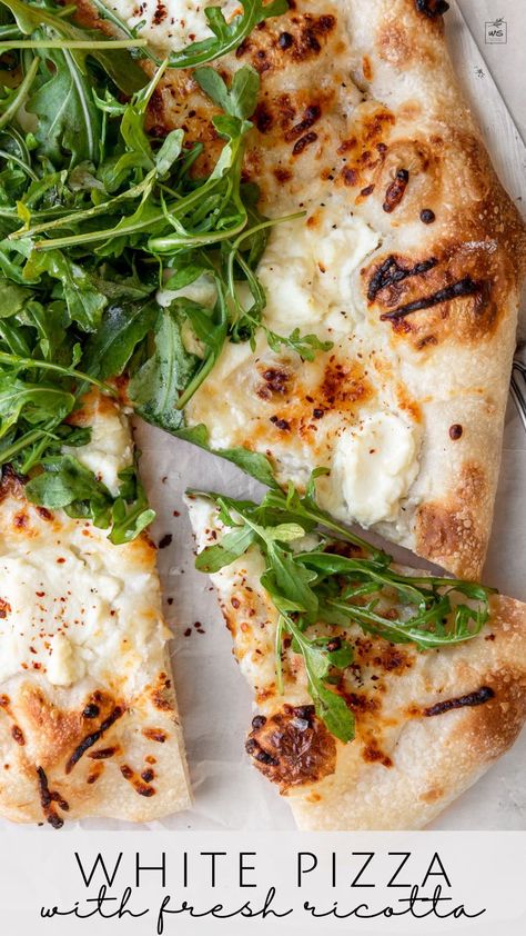 This healthy white pizza recipe is spread with a creamy garlic-scented white sauce and topped with mozzarella, parmesan, and fresh ricotta. Add a pop of freshness with a simple arugula salad or serve it as is for dinner or as an appetizer. White Sauce Pizza, Arugula Pizza Recipes, Recipe With Mozzarella, Pizza With Ricotta, Simple Arugula Salad, White Sauce Pizza Recipe, Pizza With Mozzarella, Garlic Flatbread, Ricotta Sauce