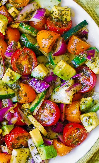 Tomato Cucumber Avocado Salad with Basil Pesto – Healthy, Mediterranean recipe with lots of fresh vegetables.   This recipe uses just a few ingredients, it’s easy to make, and the salad looks beautiful on the table for so little effort.  Use both red and yellow cherry tomatoes (or grape tomatoes) to add colors! Tomato Cucumber Avocado Salad, Yellow Cherry Tomatoes, Salad Sayur, Mediterranean Recipe, Cucumber Avocado Salad, For Two, Cucumber Avocado, Resep Salad, Tomato Cucumber