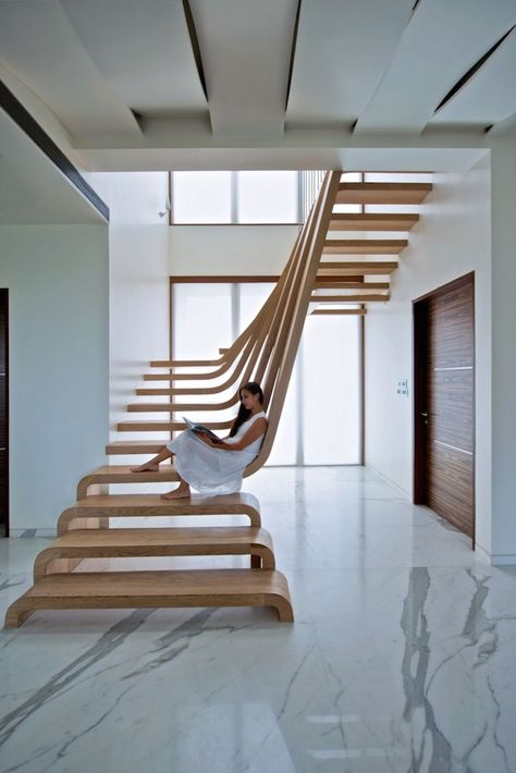 Beautifully Sloping Wooden Staircase Creates a Sense of Flow in the Home - My Modern Met Wooden Staircase, Beautiful Stairs, Escalier Design, Wood Staircase, Stairs Design Modern, Stair Case, Modern Stairs, Wooden Staircases, Interior Stairs