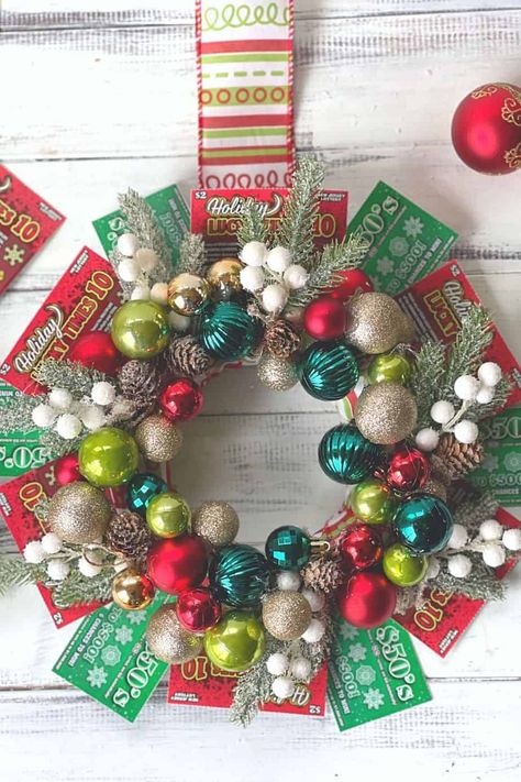 Deck the halls this holiday season with this DIY NJ Lottery ticket Christmas wreath. This unique ornament wreath is a great gift idea for friends and family too. What a perfect way to share some luck this holiday season. Lottery Wreath Ideas, Lotto Ticket Wreath, Lottery Ticket Wreath Diy, Christmas Lottery Ticket Gift Ideas, Lottery Ticket Wreath, Gift Card Wreath, Lottery Ticket Christmas Gift, Lottery Ticket Tree, Easy Diy Holiday Crafts