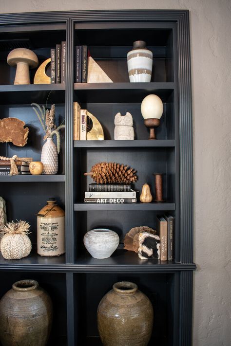 Dark & Moody Living Room Décor [+ Easy Fall Style Ideas] — Greenhouse Studio Dark Grey Bookcase, Bookshelf Decor Dark Wood, Styling Dark Wood Bookshelves, Styling Dark Shelves Living Room, Dark Grey Bookshelves, Styling Dark Shelves, Dark Bookcase Styling, Moody Shelves, Moody Bookcase