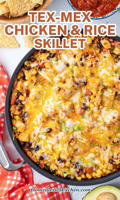 This cheesy one pot Tex-Mex Chicken and Rice Skillet is loaded with corn, peppers, and black beans for a hearty, delicious meal. It's ready in just 30 minutes and cleanup is a breeze! Chicken Rice Beans, Chicken And Rice Skillet, Chicken Rice Skillet, Chicken Enchilada Skillet, Mexican Chicken And Rice, Tex Mex Chicken, Rice And Beans Recipe, Corn Chicken, Rice Skillet