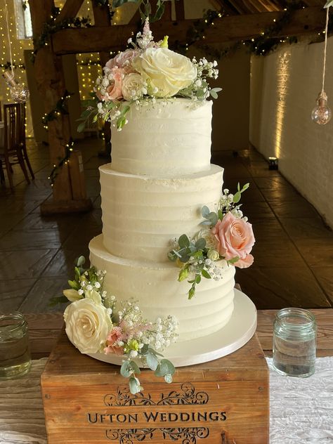 3 tier buttercream frosted wedding cake with fresh flowers including roses, lisianthus, gypsophilia and eucalyptus 3 Tier Wedding Cake With Flowers, Cakes With Real Flowers, Frosted Wedding Cake, Wedding Cake With Fresh Flowers, 3 Tier Wedding Cake, Cake With Fresh Flowers, Cream Wedding Cakes, Three Tier Cake, 3 Tier Wedding Cakes