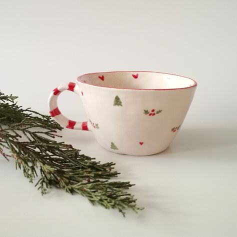 Height: 2.4 inches/ 6 cm Width: 5.4 inches / 13 cm (including handle) Capacity: 4.9 oz / 270 ml Indulge in the festive spirit with our "Christmas Joy Handmade Ceramic Coffee Cup." This charming mug is not just a beverage holder; it's a piece of holiday art meticulously crafted for those who appreciate the warmth of handmade ceramics. The cup features a delightful Christmas pattern, adding a touch of seasonal magic to your daily coffee ritual. 🎄 Handcrafted Elegance: Carefully molded and painted