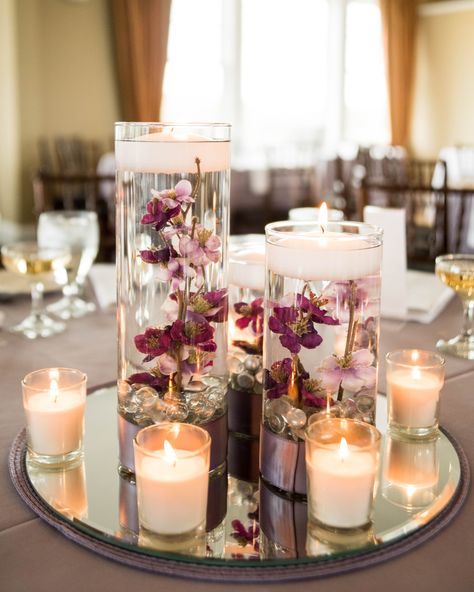 20th Anniversary Centerpieces, Wedding Centerpieces With Mirrors, Engagement Centrepiece, Mirror Candle Centerpiece, Flower And Candle Centerpiece, Candle Water Centerpiece, Mirror Wedding Centerpieces, Purple Floating Candles, Floating Votive Candles