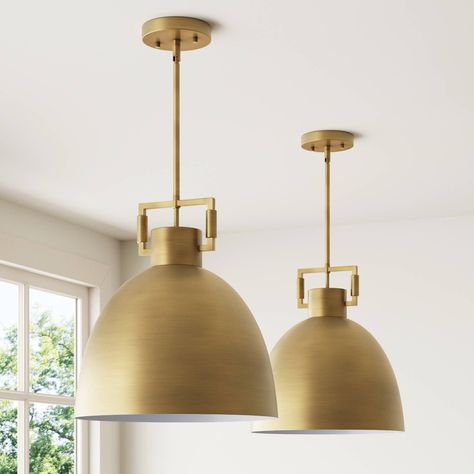 Leigh hanging light fixture is crafted of a simple silhouette of metal, the Leigh pendant light is as elegant as it is industrial. It's oversized metal shade adds a striking dramatic effect to the room, while also providing plenty of warmth. The antiqued brass structure is meant to elevate your home and adds a timeless touch to any aesthetic. This single ceiling light has an adjustable height, making it perfect for pairing in the kitchen, in an entryway, or above your bedside tables. Nathan Jame Lights Over Kitchen Island, Nathan James, Bronze Kitchen, Dome Pendant Lighting, Island Pendant Lights, Garage Apartment, Single Pendant Lighting, Brass Pendant Light, Hanging Ceiling Lights