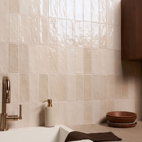 Shop Portmore Sand 3x8 Glazed Ceramic Tile. Ceramic with a handmade look Refresh any space with our Portmore Sand 3x8 Glazed Ceramic Tile, a versatile, classic subway in a go-to neutral shade that suits any design style. Portmore’s appearance—speckled, uneven, and artisanal—lends it a rustic, yet sophisticated vibe. With its subtle, Moroccan influence, this glazed tile will transform your residential or commercial walls with long-lasting, statement-making beauty. Moroccan-inspired, made in Spain Colored Subway Tile Kitchen, Dark Bathroom Wall Tile, Blush Tile Bathroom, Boho Tile Bathroom, Bathroom Tile On Wall, Cream Tile Bathroom, Cream Bathroom Tiles, Beige Shower Tile, Steam Bathroom