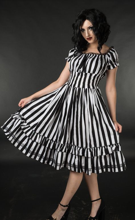 This lovely gothabilly dress features an eye catching black and white vertical stripe design, with a slightly flared skirt, black lace trimmed neckline, and short capped sleeves. White Striped Dress Outfit, Striped Dress Outfit, Vertical Striped Dress, Silver Cocktail Dress, Black And White Striped Dress, Plum Dress, Dresses By Color, Silver Cocktail, Stripe Outfits