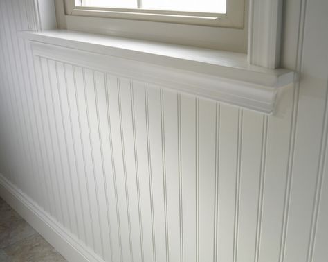 On the back wall, what looks like old-fashioned, carpenter-built tongue-and-groove wood paneling is prefabricated MDF fiberboard. It can be sourced at building supply stores, such as Lowe's, where White/Satin Hardboard Wall Paneling is $19.98 for an approximately four-by-eight-foot panel. Basement Wainscoting, Wainscoting Staircase, Wainscoting Nursery, Wainscoting Hallway, Wainscoting Stairs, Wainscoting Kitchen, Faux Wainscoting, White Wall Paneling, Wainscoting Bedroom