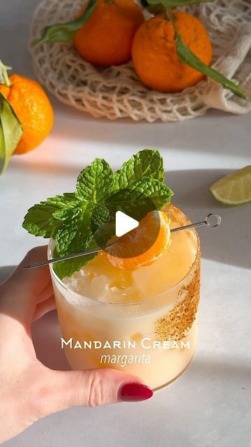 Kelly Pettit on Instagram: "Mandarin Cream Margarita 🍊☁️ a real dream of a cocktail

1 1/2 oz tequila
4-5 mandarin slices
1 oz coconut cream
3/4 oz lime juice
1/2 oz Cointreau
1/2 oz agave

Method: add mandarin slices and lime juice to a cocktail shaker and muddle. Add in the rest of the ingredients, add ice, and shake for 7 seconds. Rim a glass with agave and coconut sugar. Double strain the cocktail into the glass over ice. Garnish with fresh mint and a mandarin wedge. Enjoy!

#cocktail #cocktails #cocktailidea #cocktailideas #cocktailrecipe #cocktailrecipes #cocktailgram #cocktailtime #cocktailoftheday #margarita #tequila" Mandarin Cream Margarita, Homemade Booze, Drink Night, Margarita Tequila, Coconut Margarita, Tequila Margarita, Boozy Desserts, Beverage Recipes, Best Appetizer Recipes