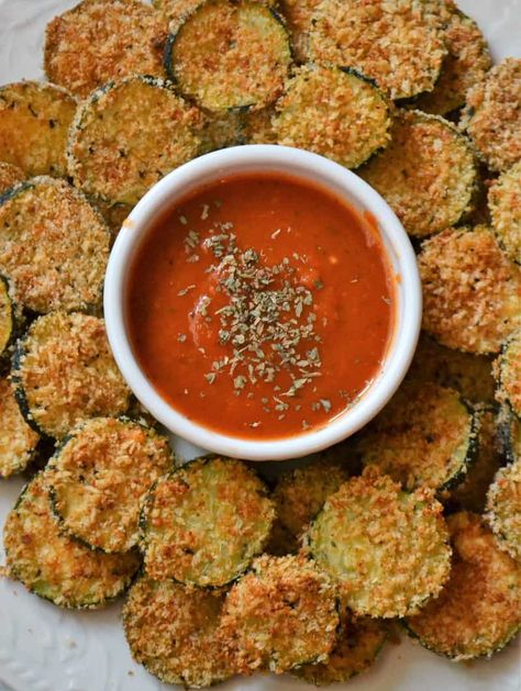 a plate of crispy oven fried zucchini Breaded Zucchini, Oven Fried Zucchini, Deep Fried Zucchini, Pan Fried Zucchini, Fried Zucchini Recipes, Zucchini In The Oven, Zucchini Appetizer, Crispy Oven Fries, Fried Zucchini