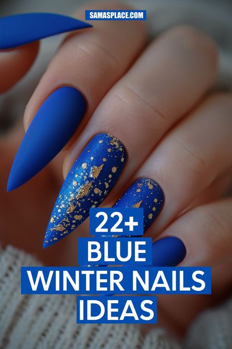 Matte blue nails with gold glitter near the cuticles for a luxurious, understated effect. The stiletto shape adds sophistication, making it ideal for holiday occasions. Blue Gold Glitter Nails, Midnight Blue Nails With Silver, Royal Blue Matte Nails Design, Blue Stellio Nails, Nye Nails Blue, Navy Blue Celestial Nails, Dark Blue Winter Nail Designs, Elegant Navy Blue Nails, Mat Blue Nails