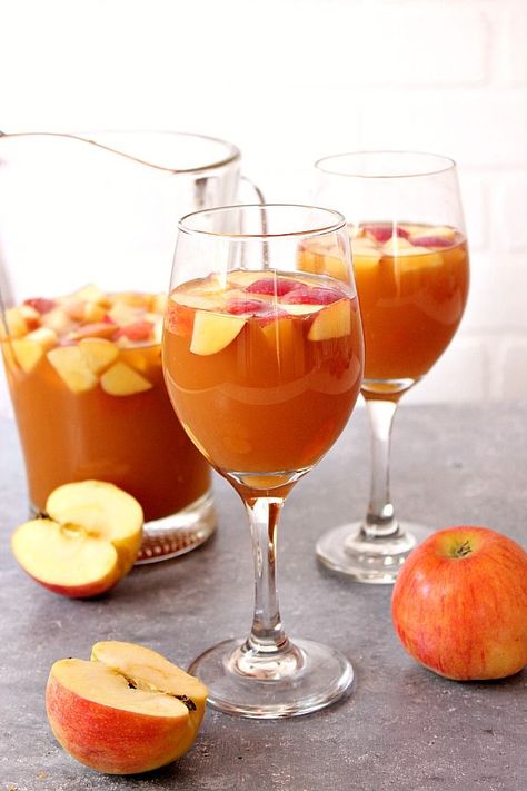 Caramel Apple Sangria Recipe - apple cider, caramel sauce and white wine make this fall themed sangria a hit for gatherings and parties! www.crunchycreamysweet.com Apple Pie Sangria, Apple Sangria Recipes, Cider Caramel, Apple Cider Sangria Recipe, Fall Sangria Recipes, Caramel Apple Sangria, White Wine Sangria Recipe, Apple Crumb Cakes, Apple Sangria