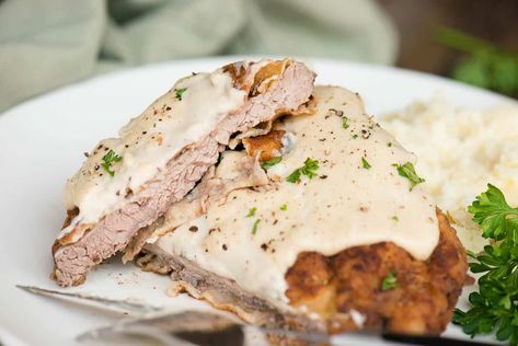 Country Fried Steak, also known as Chicken fried steak, is a Southern food classic but is so easy to make at home. Tenderized round steak, or cube steak, is breaded and fried to a crispy golden brown. The pan drippings are used to make a flavorful creamy milk gravy so you can smother the steaks. Serve with mashed potatoes for a decadent comfort food dinner. Tenderized Round Steak, Beef Cube Steak Recipes, Country Fried Steak Recipe, Easy Pork Tenderloin Recipes, Easy Pork Tenderloin, Chicken Fried Steak Recipe, Milk Gravy, Fried Steak Recipes, Cubed Steak