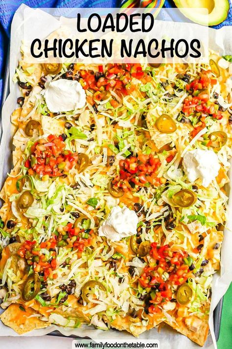 Loaded chicken nachos with black beans and plenty of cheese are made in a double layer to ensure tons of good stuff on every chip. Add ALL your favorite toppings and dig in! Chips And Cheese Nachos, Shredded Chicken Nachos Easy, Baked Chicken Nachos, Loaded Chicken Nachos Recipe, Loaded Chicken Nachos, Shredded Chicken Nachos, Ultimate Nachos, Mexican Nachos, Baked Chicken Casserole