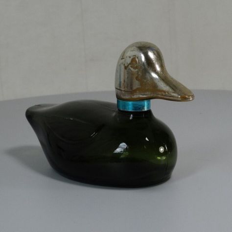 Add some vintage charm to your collection with these Avon perfume and after shave decanters! From a green Mallard Duck to a Sherlock Holmes Bulldog Pipe, these bottles are perfect for display or everyday use. #Avon #Vintage #Perfume #AfterShave #Decanter #Bottle #DucksAndChicks #Bulldog #ElectricCharger #StanleySteamer #WildCountry #Glass #MadeInTheUSA  #Bulldog #Whitemilkglass Green Perfume, Avon Perfume Bottles, Duck Green, Cologne Bottle, Avon Collectibles, Avon Perfume, Avon Vintage, Mallard Duck, Aftershave