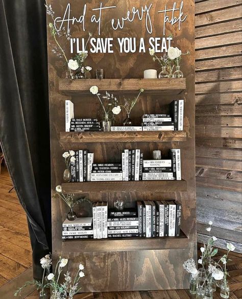 Book Wall Seating Chart, Seating Chart Bookshelf, Wedding Book Seating Chart, Bookshelf Wedding Seating Chart, Seating Chart Books, Wedding Decor Books, Subtle Taylor Swift Wedding Ideas, Wedding Seating Chart Books, Taylor Swift Seating Chart Wedding