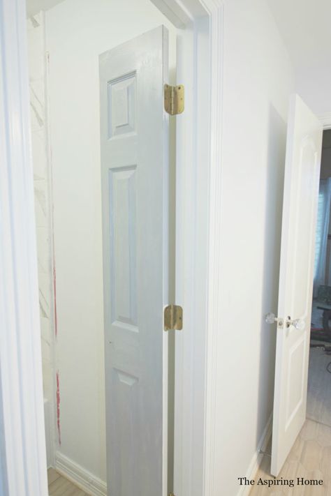 DIY Petite Double Doors From Bifold Doors | The Aspiring Home Sliding Double Doors Interior Small Spaces, Bifold Accordion Doors, Bifold Door For Bathroom, Paint Bifold Doors, Double Door For Bedroom, Vertical Split Door, Bathroom Closet Door Ideas Small Spaces, Tiny Bathroom Door Ideas, Diy Bathroom Door Ideas