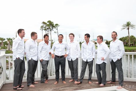 Groomsmen: J. Crew Bowery Classic Pants in Heather Grey; Preacher: J. Crew Bowery Classic Pants in Light Heather Grey; Groom: J. Crew Charcoal Grey Ludlow Suit - All in the same white J. Crew button up - So much easier(& cheaper) than renting tuxes! And most of the guys now say this is their favorite outfit! Groomsmen Beach Attire, Night Beach Weddings, Beach Wedding Groom Attire, Casual Groom Attire, Beach Wedding Groom, Beach Wedding White, Groom Wedding Attire, Groom And Groomsmen Attire, Grey Wedding