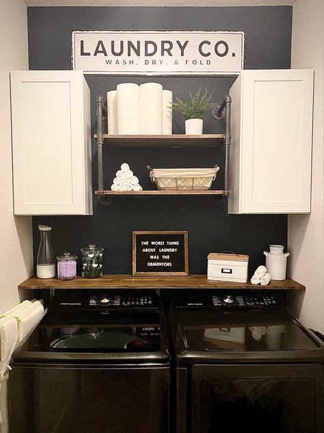 Our new house came with a smaller laundry room. Initially having only a single wire shelf from wall to wall, this revamp gave us a ton more space! I love how it fits in with the rest of our house now, and I’m not ashamed to keep it open when we have company over! Laundry Room Black Accent Wall, Laundry Room Ideas Small Space Farmhouse, Laundry Room Shelf Decor Ideas, Black Laundry Room Walls, Laundry Wall Ideas, Farmhouse Small Laundry Room, Open Laundry Room Ideas, Small Narrow Laundry Room Ideas, Black Laundry Room Ideas