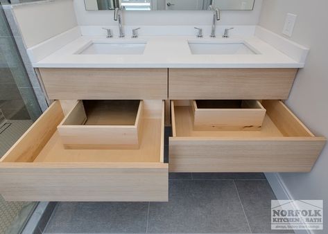 The bathroom in this modern Boston condo was designed by David from our Braintree showroom, in collaboration with the project’s developer: HRV Homes. The design features flat-panel cabinetry from our full-access line: ShowplaceEVO, and a stunning glass shower. The floating vanity features deep double drawers with cut-outs for the dual sink plumbing. Cabinets: ShowplaceEVO Finish: Natural Vanity tops: Unknown David also designed the kitchen in this home. [...] Built In Sink Vanity, Floating Vanity With Drawers And Shelf, Floating Bathroom Vanity With Drawers, Bathroom Drawers Cabinet, Vanity With Drawers Bathroom, Double Vanity With Drawers, Floating Bathroom Vanity Double Sink, Floating Double Vanity Bathroom, Dual Sink Bathroom Vanity