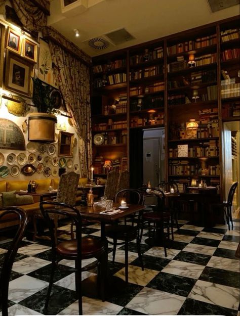 Goth Cafe Interior, Library Bakery Aesthetic, Old Fashioned Cafe Interior, Bookstore Cafe Aesthetic Vintage, Cozy Bookshop Cafe Aesthetic, Bookstore Tea Shop, Coffee Shop Interior Design Cozy Vintage, 1920s Coffee Shop, Cozy Coffee Shop Aesthetic Vintage