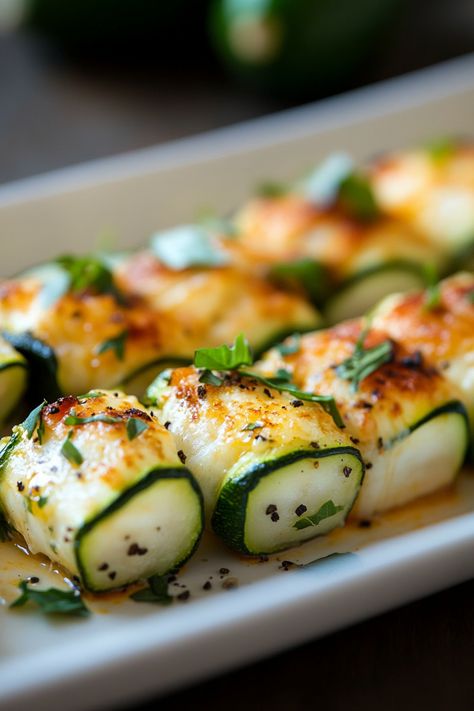 Grilled zucchini roll-ups with melted cheese and herbs on a white plate. Ground Beef Ricotta, Zucchini Roll, Low Carb Zucchini Lasagna, Turkey Ground, Zucchini Lasagna Rolls, Tips For Meal Prepping, Jackfruit Sandwich, Zucchini Rolls, Vegetarian Meat