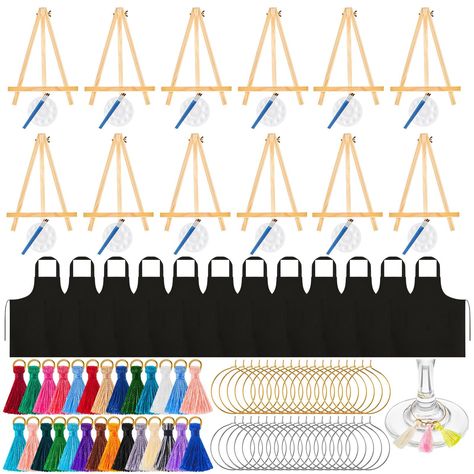 PRICES MAY VARY. Complete Painting Supplies: you will receive 135 pieces of painting party supplies, including 12 black aprons, 12 easels, 12 sets of painting brushes, 12 palettes, 29 tassel decors, 29 gold wine glass charms, and 29 silver wine glass charms Multifunctional Design: the wooden desktop easel, brush, and palette can meet your various painting needs, suitable for watercolor painting, acrylic painting, oil painting, gouache painting, the foldable wooden easel is about 11.8 inches in h Desktop Easel, Sip And Paint, Gold Wine, Painting Brushes, Painting Gouache, Sip N Paint, Painting Party, Wooden Easel, Tassels Decor