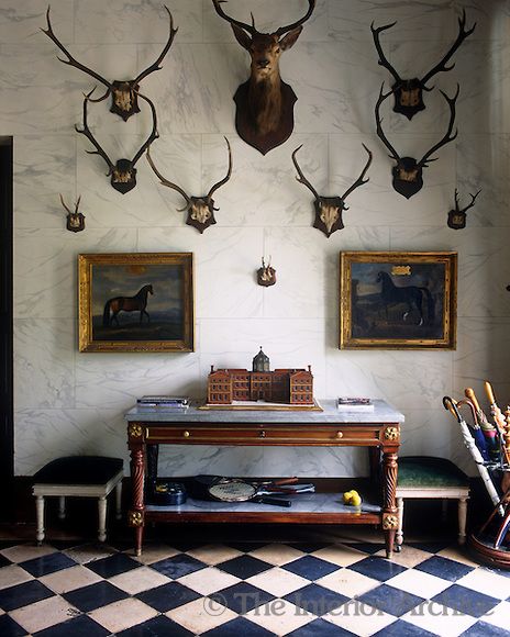 Sets of antlers are dsiplayed on the marbleised wall of the entrance hall ~ Chateau de Groussay, photo by Christopher Simon Sykes Deer Heads, Hunting Room, Trophy Rooms, The Enchanted Home, Casas Coloniales, Enchanted Home, Hunting Lodge, Entrance Hall, Beautiful Interiors