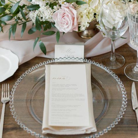 A springtime table setting is always beautiful. 🌷Click through to rent our Clear Glass Bead Chargers for your event.   Planner: @weddingsbyalexandria   #weddingcharger #tablesettingideas #clearcharger #glasscharger #dinnermenueideas #eventmenu #menucalligraphy #stationerydesign #eventstationery #tablescapeinspiration #pinktablescape #pinktablesetting #rustictablesetting #simpletablesetting Clear Charger Plates Wedding, Charger Plates Table Setting, Wedding Plate Set Up, Gold Charger Plates Wedding, Chargers Plates Table Setting, Wedding Plate Setting, 30th Anniversary Party, Pink Table Settings, Silver Charger Plates