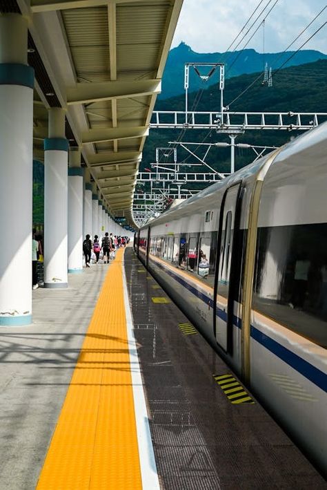 High-speed Train at Modern Railway Station · Free Stock Photo Modern Train Station, Transport Hub, Train Projects, Train Platform, Mountain Backdrop, Object Photography, Speed Training, Train Journey, All Aboard