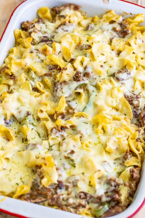 A baked Philly Cheesesteak Casserole in a dish. Philly Cheese Steak Bake, Steak Peppers And Onions, Philly Cheesecake, Philly Cheese Steak Casserole Recipe, Steak Peppers, Philly Cheesesteak Casserole, Cheesesteak Casserole, Philly Cheese Steak Casserole, Baked Steak