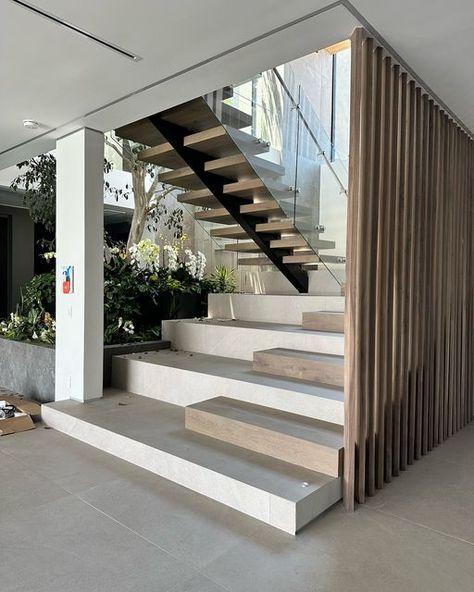 AHD | Interior Designer LA on Instagram: "Staircase design for a client 🤎 Combination of tile and wood, creating a functional and beautiful centerpiece in the home. More pictures to come from this newly finished project!!   #modernhome #InteriorDesign #modernstaircase #moderndesign #modernarchitecture #staircasedesign" Staircase Below Design, Modern House Staircase, U Shape Staircase, Staircase Tiles, Contemporary Staircase Design, U Shaped Staircase, Staircase Interior Design, Contemporary Stairs, Contemporary Staircase