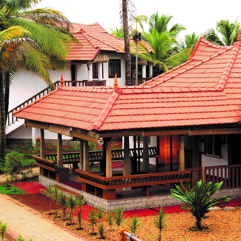 The uniqueness of the Backwater Ripples resort designed by Benny Kuriakose is that twenty-one cottages and twelve rooms have been comfortably accommodated on a small plot of land abutting Lake Vembanadu. #TraditionalKeralaResortsDesign#MangaloreTileRoof #EntranceVerandaDesign Small House Design Kerala, Kerala Traditional House, Kerala Architecture, Plot Of Land, Lakeside Resort, Lake Houses, Indian Home Design, Kerala House Design, Kerala Houses