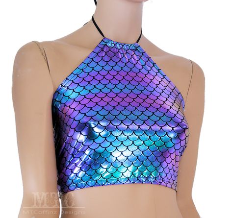 This halter top is made with soft and stretchy swimsuit stretch fabric.  It's color shifting purple and blue metallic dragon scales  The top laces in the back with hand set industrial grommets. The whole thing is stretchy so you can move freely and comfortably. Safe for the washing machine. The standard size fits A-D sizing and the Full size will fit D-F. If you require a fuller bust or more coverage (longer in front) please ask and I'll be happy to set up a custom listing for you.  If you love Metallic Dragon, Oc Au, Silicone Mermaid Tails, Corset Lacing, Ren Fest, African Paintings, Dragon Scales, Womens Halter Tops, Edm Festival