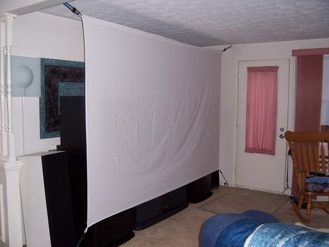 DIY projector screen made with bed sheets and bungee cord ... For now at least Diy Projector Screen, Home Projector Screen, Homemade Projector, Diy Projection Screen, Projector Paint, Projector Screen Diy, Projector In Bedroom, Diy Outdoor Movie Screen, Diy Projector