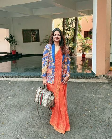 ⚜️ #SAUNDHTRIBE | The equation of power looks: 2 timeless silhouettes = 1 stand-out ensemble 🧡✨ @michelle_dominica wearing • Nargis Stitched Saree, paired with the blazer of the Aria Pantsuit #SaundhIndia #Saundh #EverydayLuxury #MadeInIndia #WomenInSaundh #stitchedsaree #womeninpower #SaundhSignature #printedblazer #powerblazer Product##https://saundh.com/collections/designer-sarees/products/nargis-stitched-saree-orange# Saree With Blazer, Saree Orange, Timeless Silhouettes, Stitched Saree, Printed Blazer, Designer Sarees, Everyday Luxuries, Indian Dresses, Saree Designs